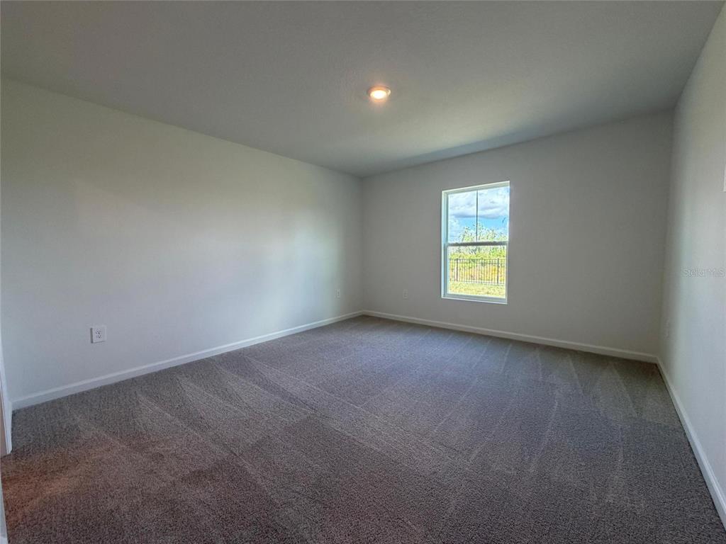 3484 Chinotto Drive Lake Alfred, FL 33850 - Photo 14 of 32 an empty room with a window