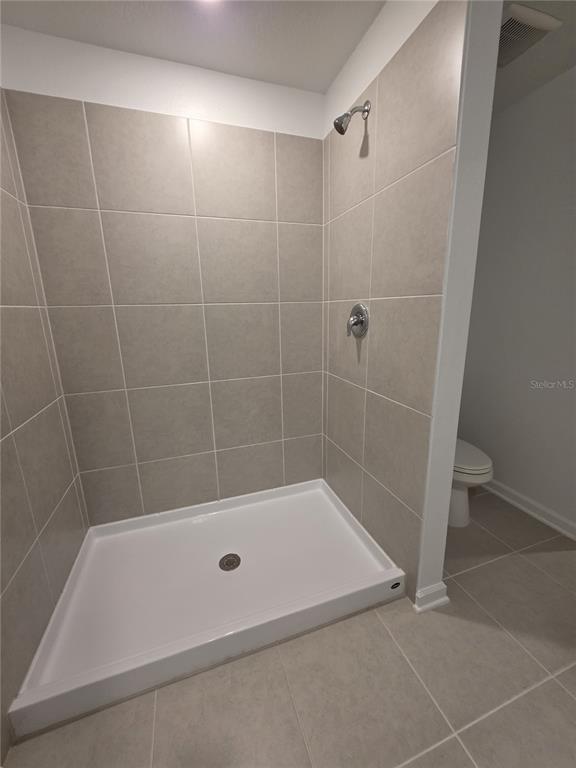 3484 Chinotto Drive Lake Alfred, FL 33850 - Photo 20 of 32 a bathroom with a bathtub