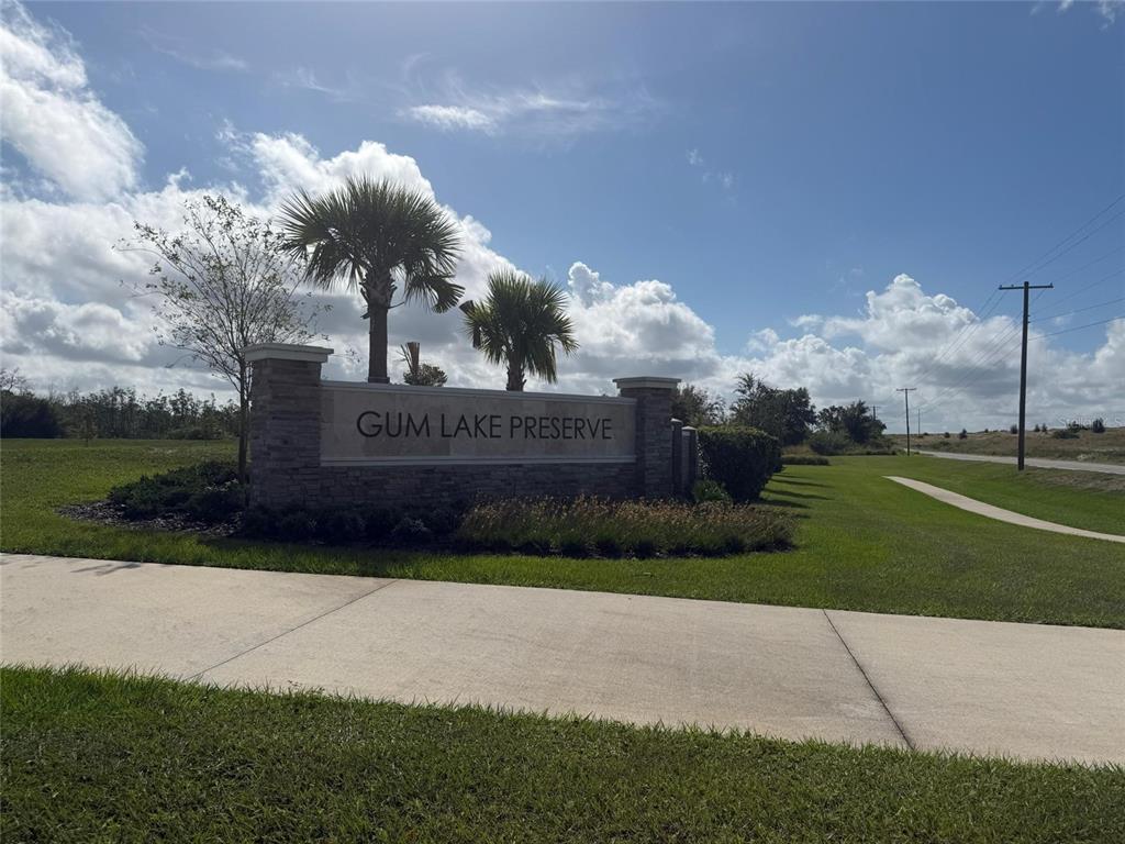 3484 Chinotto Drive Lake Alfred, FL 33850 - Photo 2 of 32 a sign on the side of the road