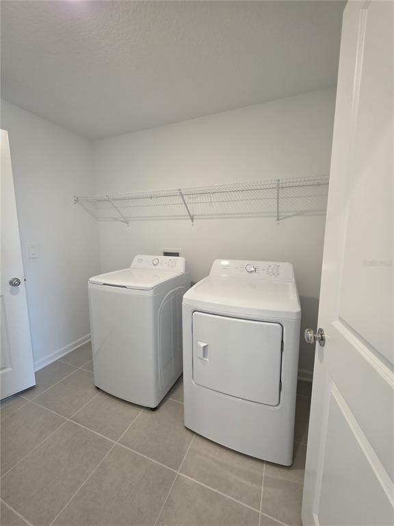 3484 Chinotto Drive Lake Alfred, FL 33850 - Photo 21 of 32 a utility room with dryer and washer