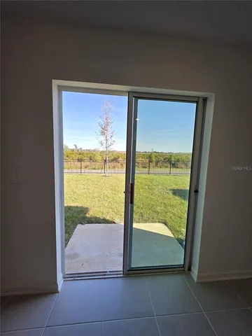 a view of a house with backyard and porch