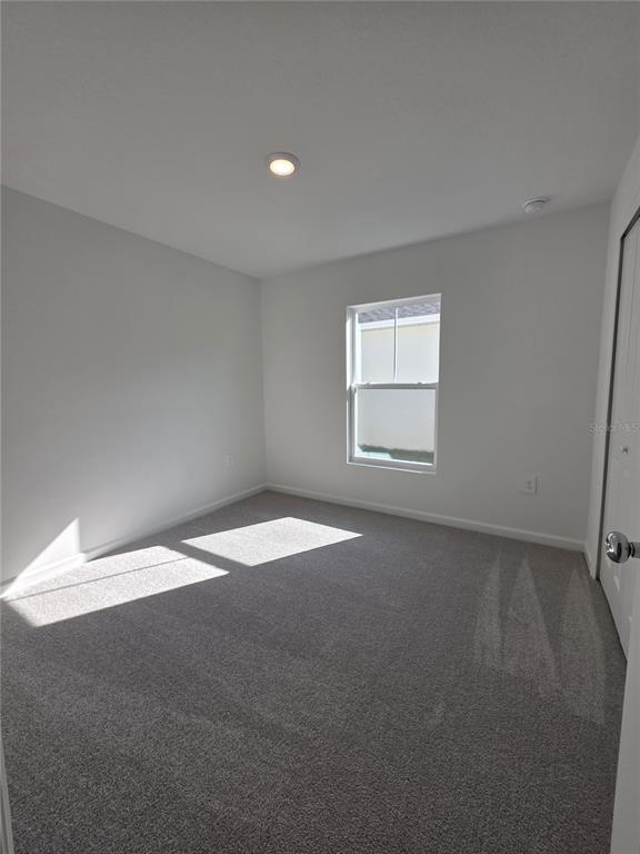 3484 Chinotto Drive Lake Alfred, FL 33850 - Photo 4 of 32 an empty room with a window