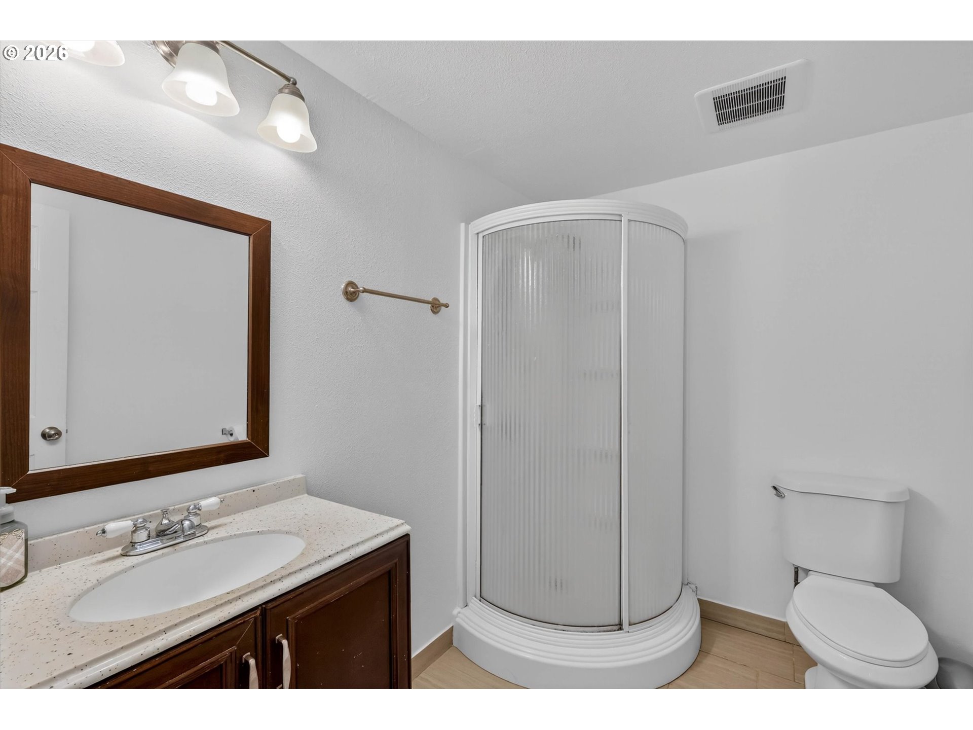 19995 Southwest York Street Beaverton, OR 97003 - Photo 22 of 37 a bathroom with a sink a toilet and mirror