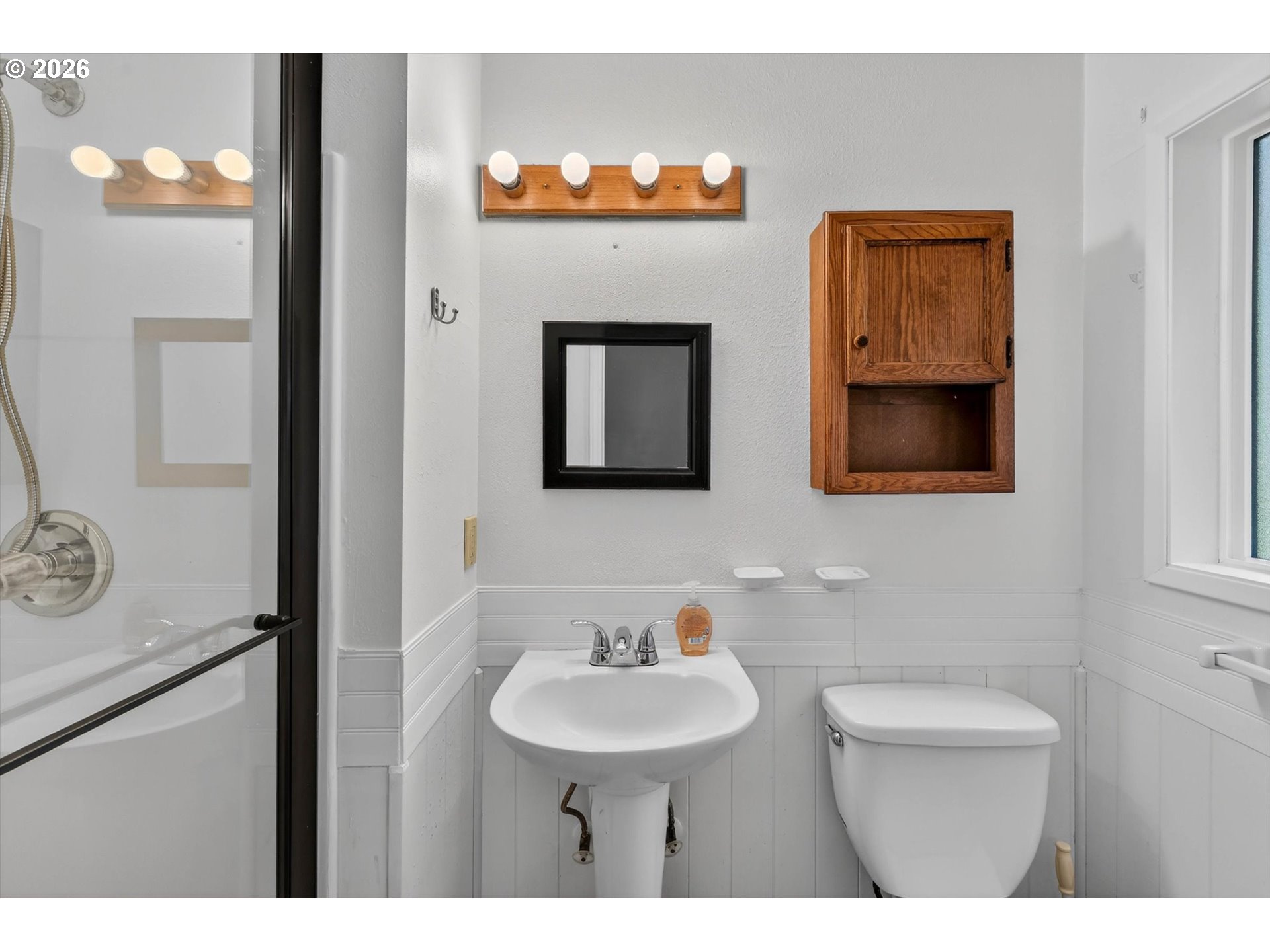 19995 Southwest York Street Beaverton, OR 97003 - Photo 27 of 37 a bathroom with a toilet sink and mirror