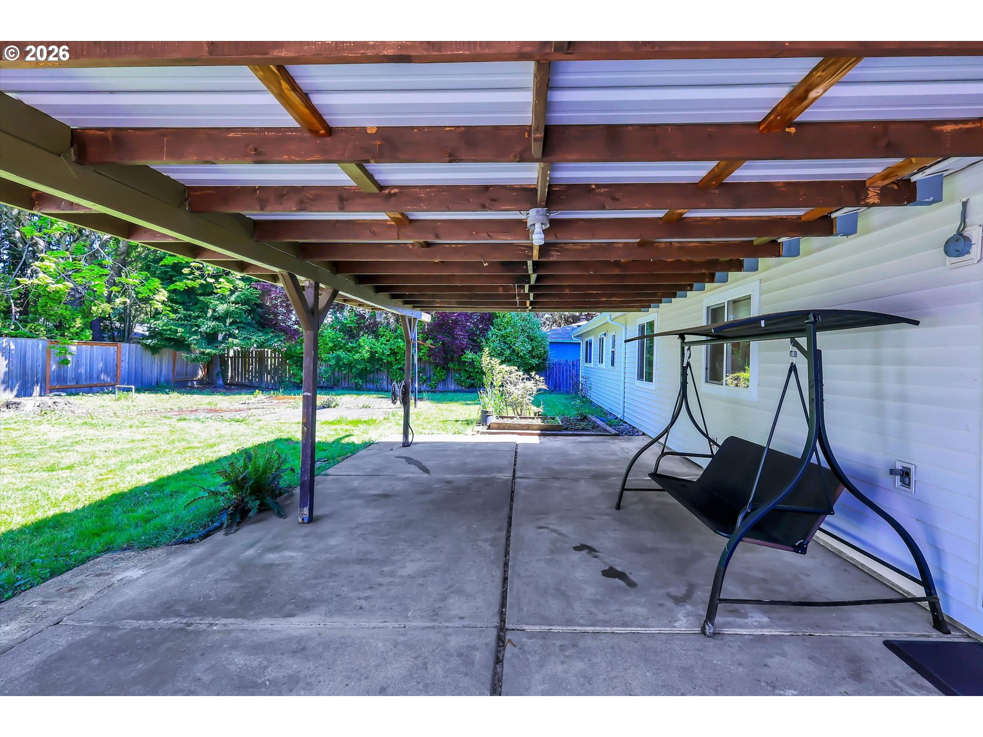19995 Southwest York Street Beaverton, OR 97003 - Photo 36 of 37 a view of a backyard with table and chairs