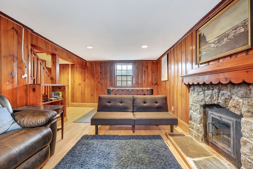 87 Payson Road Brookline, MA 02467 - Photo 33 of 41 a living room with furniture and a fireplace