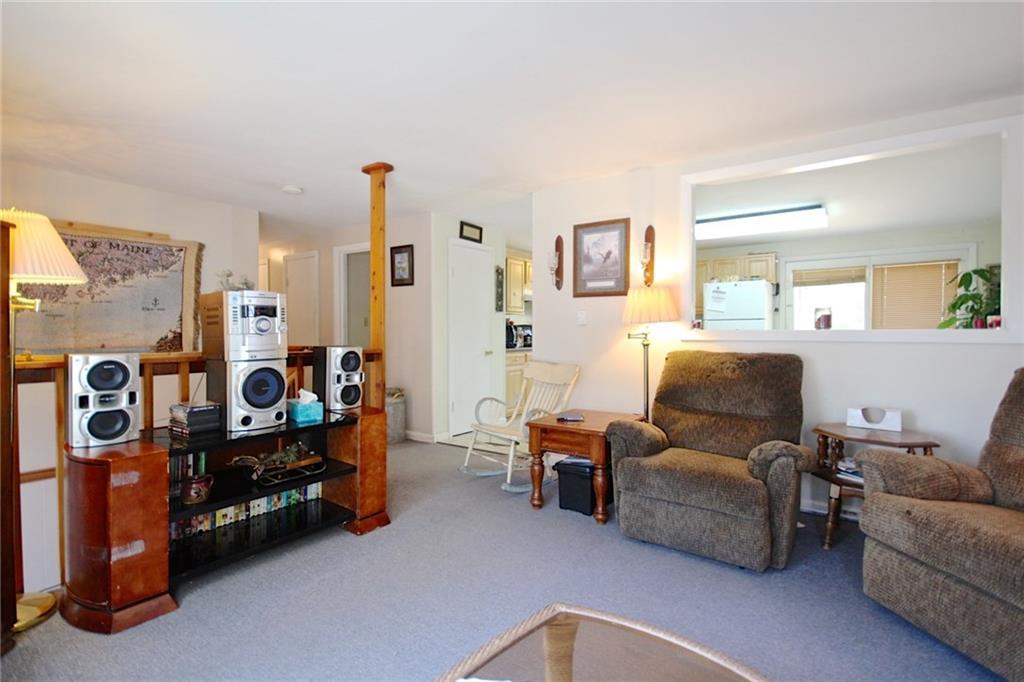 1 Wood Pond Road Brunswick, ME 04011 - Photo 11 of 31 Living room with kitchen beyond.
