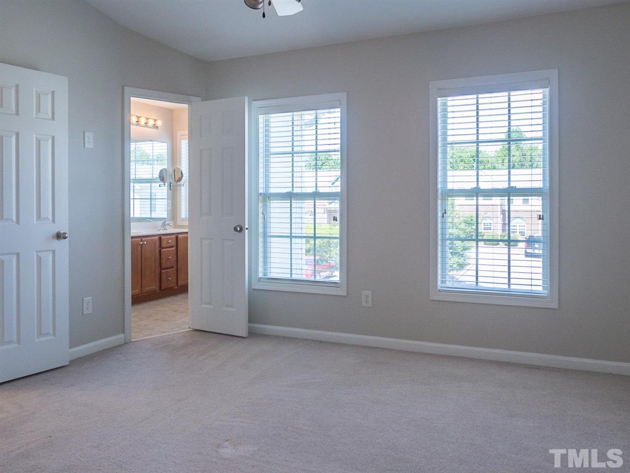 2120 Piney Brook Road, Unit 103 Raleigh, NC 27614 - Photo 14 of 22 an empty room with windows