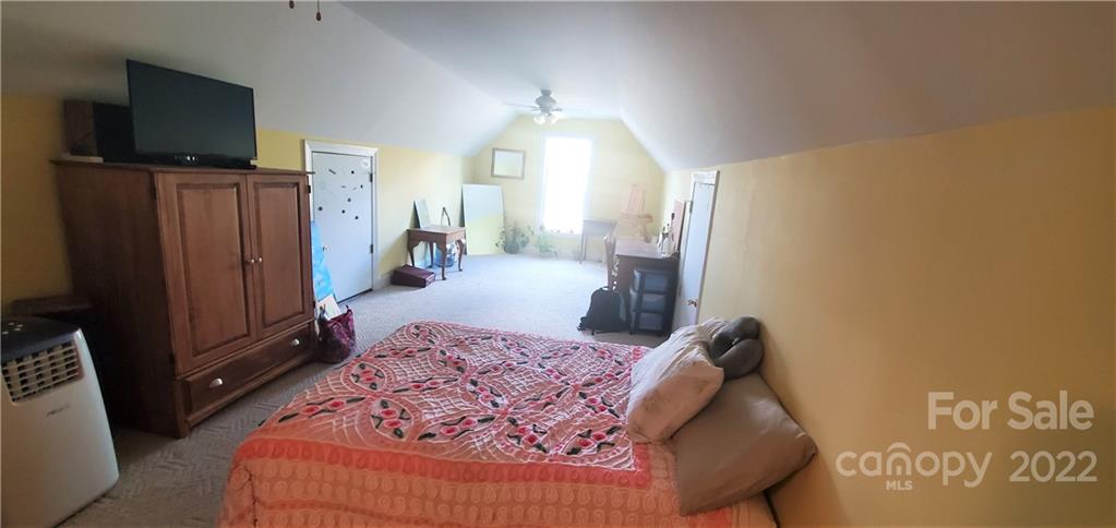 1820 Daisy Couch Road Heath Springs, SC 29058 - Photo 14 of 21 a bedroom with a bed and wooden floor