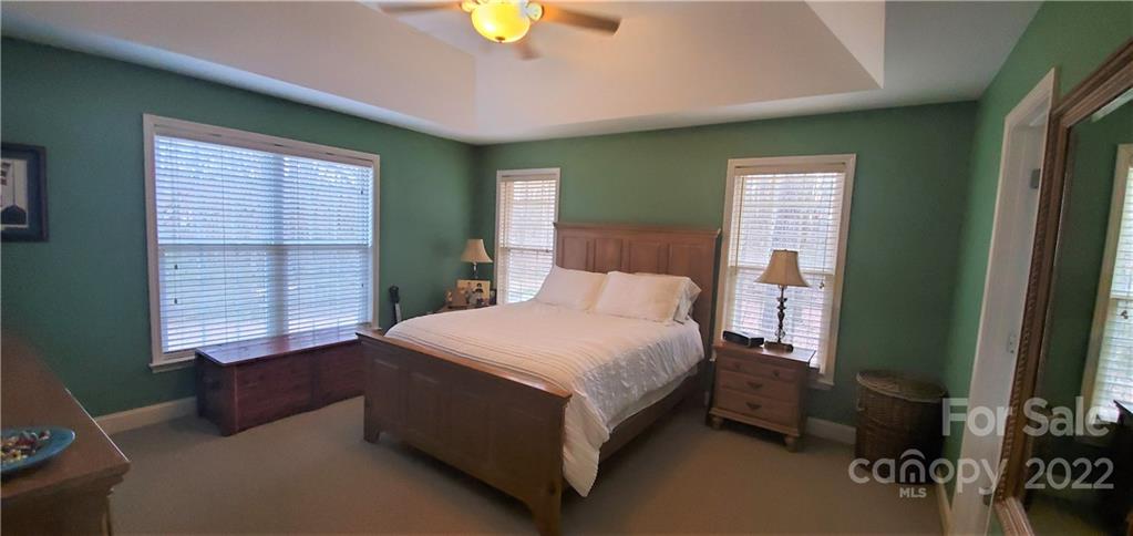 1820 Daisy Couch Road Heath Springs, SC 29058 - Photo 8 of 21 a bedroom with a bed lamp and a window