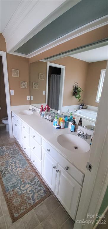 1820 Daisy Couch Road Heath Springs, SC 29058 - Photo 9 of 21 a bathroom with cabinets a sink and mirror