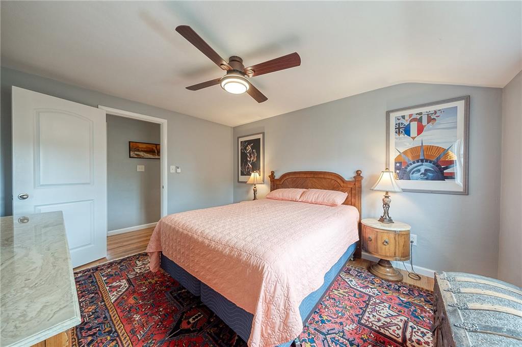 1004 Fiddleback Drive McKees Rocks, PA 15136 - Photo 12 of 41 a bedroom with bed and wooden floor