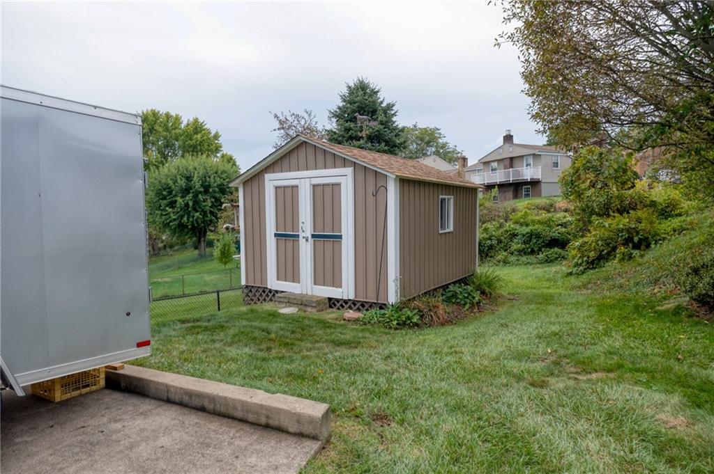 1004 Fiddleback Drive McKees Rocks, PA 15136 - Photo 13 of 41 a view of a backyard with plants and a garden