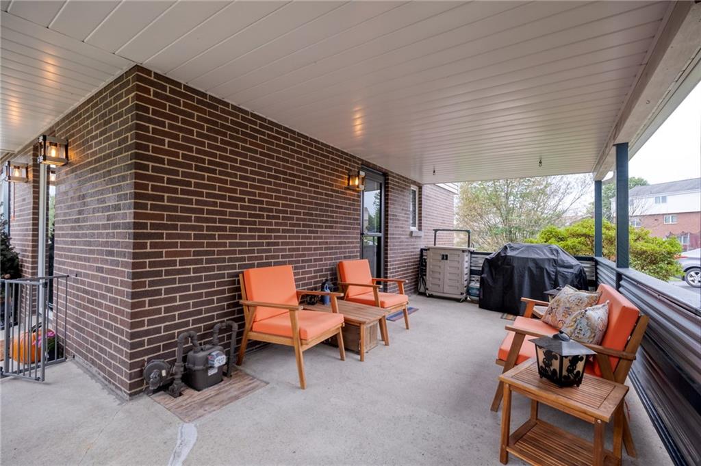 1004 Fiddleback Drive McKees Rocks, PA 15136 - Photo 15 of 41 a backyard of a house with outdoor seating