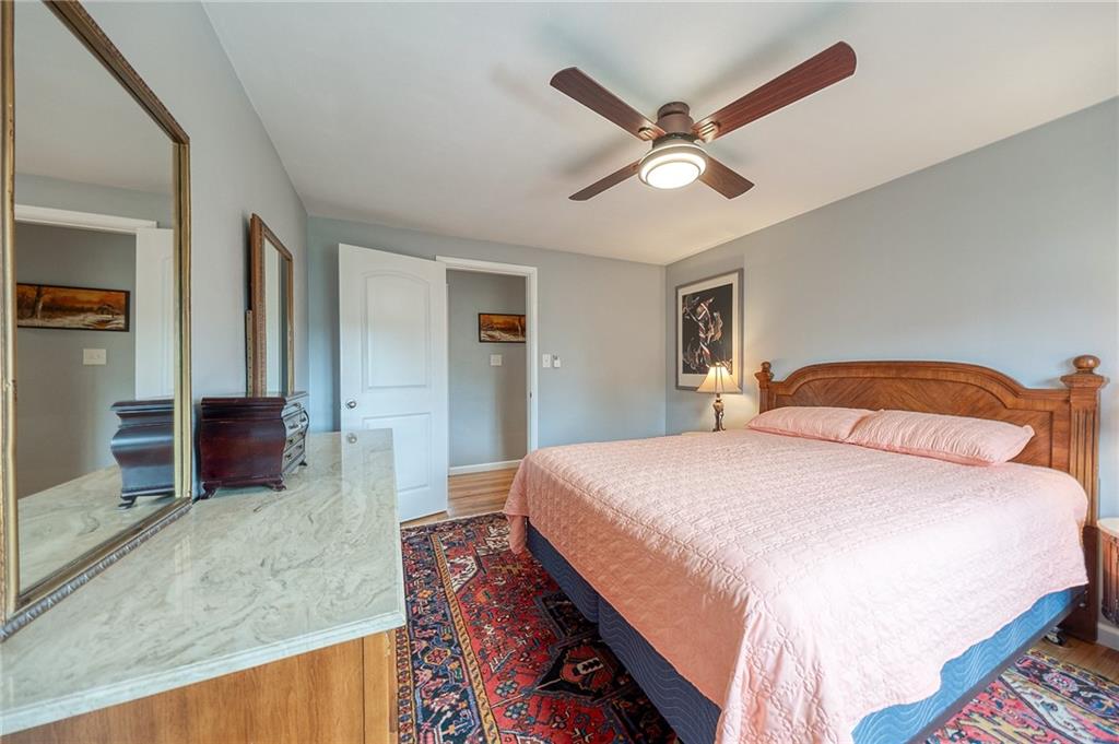 1004 Fiddleback Drive McKees Rocks, PA 15136 - Photo 17 of 41 a bedroom with a large bed and a chandelier