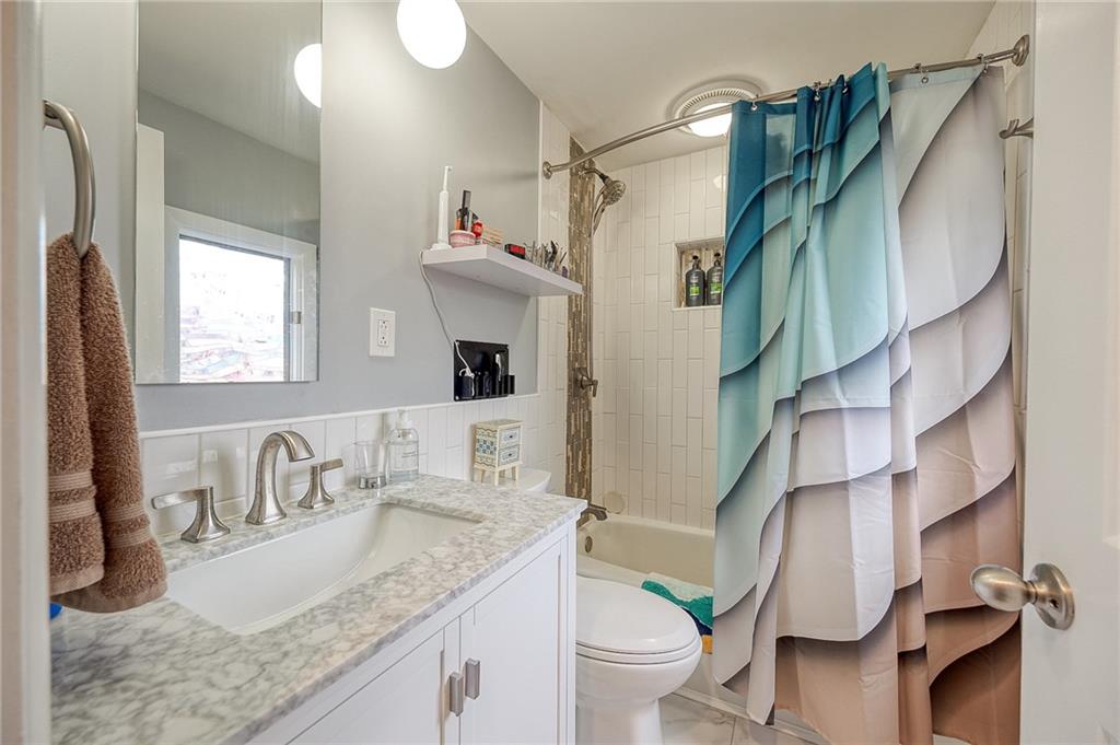 1004 Fiddleback Drive McKees Rocks, PA 15136 - Photo 21 of 41 a bathroom with a granite countertop sink toilet and shower