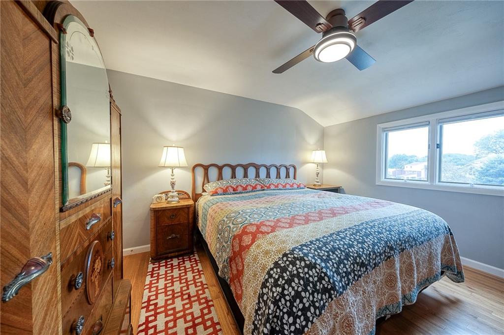 1004 Fiddleback Drive McKees Rocks, PA 15136 - Photo 22 of 41 a bedroom with a large bed and a chandelier