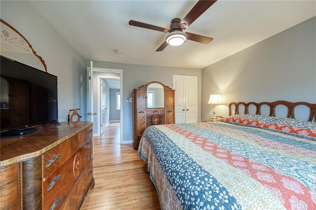 1004 Fiddleback Drive McKees Rocks, PA 15136 - Photo 23 of 41 a bedroom with bed and a flat tv screen on dresser