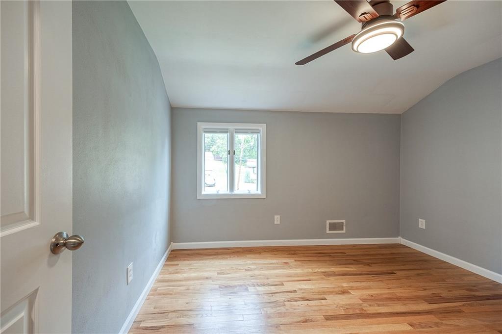 1004 Fiddleback Drive McKees Rocks, PA 15136 - Photo 24 of 41 an empty room with a hardwood and ceiling fan