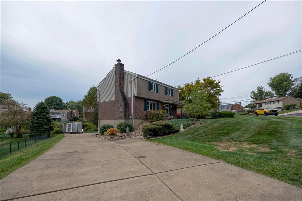 1004 Fiddleback Drive McKees Rocks, PA 15136 - Photo 32 of 41 a front view of a house with a garden