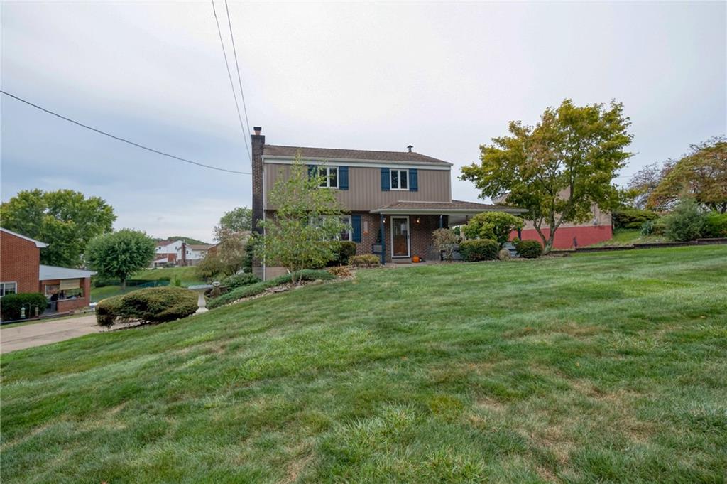 1004 Fiddleback Drive McKees Rocks, PA 15136 - Photo 40 of 41 a front view of a house with garden