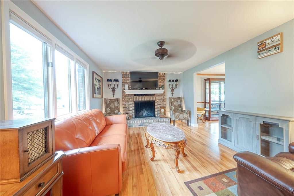1004 Fiddleback Drive McKees Rocks, PA 15136 - Photo 4 of 41 a living room with furniture a fireplace and wooden floor