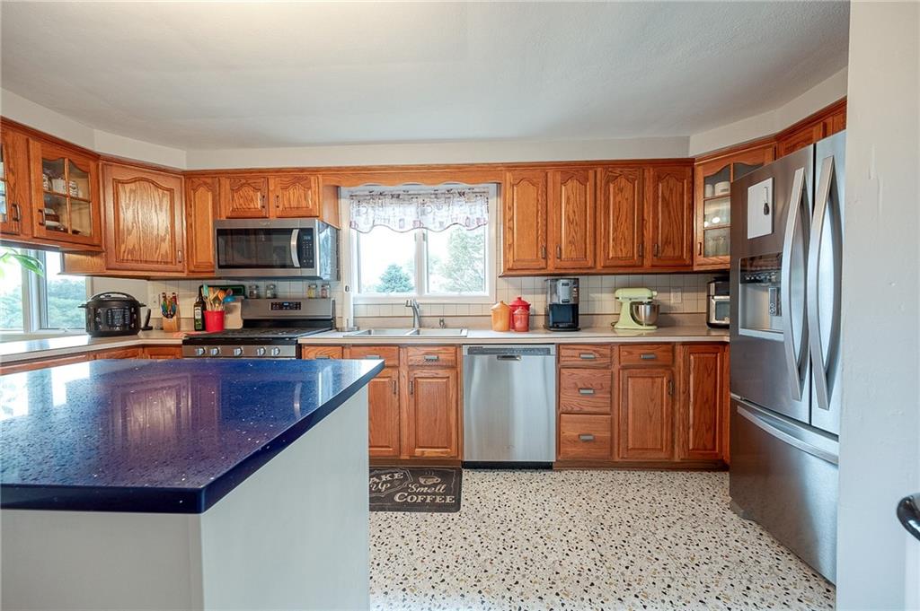 1004 Fiddleback Drive McKees Rocks, PA 15136 - Photo 8 of 41 a kitchen with stainless steel appliances granite countertop a refrigerator sink and stove