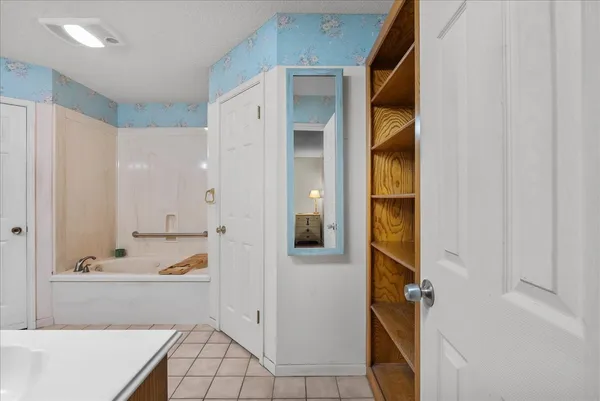 a bathroom with a bathtub and a sink