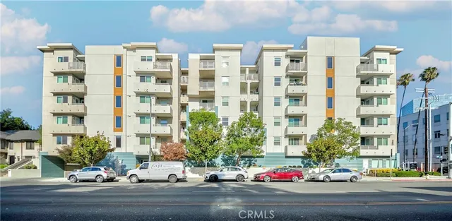 a front view of a house with lots of potted plants