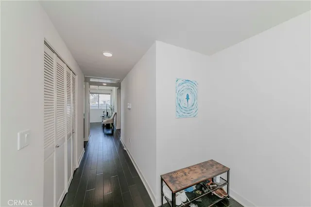 a kitchen with a sink cabinets and wooden floor