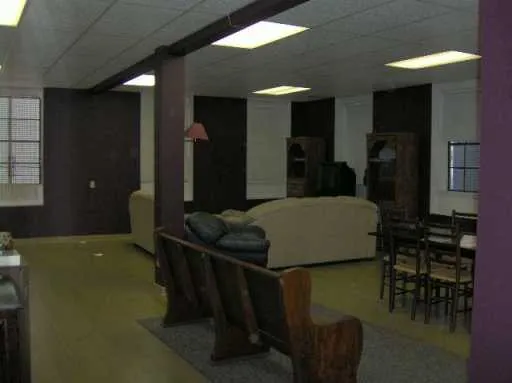 a large bedroom with a large bed and furniture