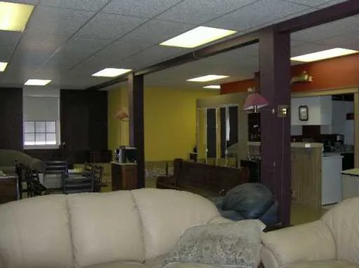 a kitchen with a refrigerator and a stove