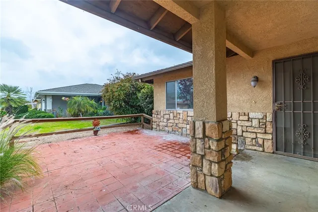 a view of swimming pool with lounge chair and porch