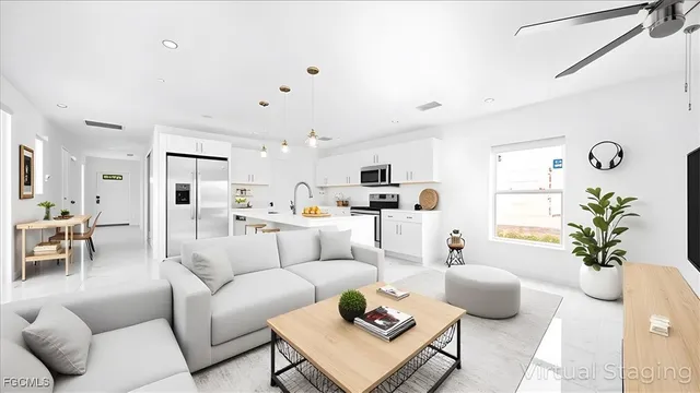 a living room with furniture and a large window