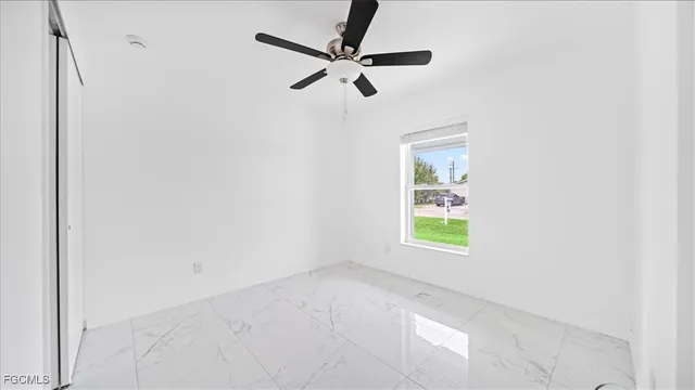 a bathroom with a shower and a glass door