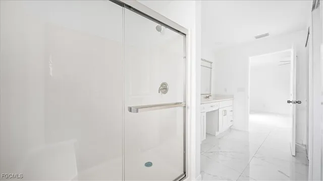 a bathroom with a granite countertop sink a toilet and a bathtub