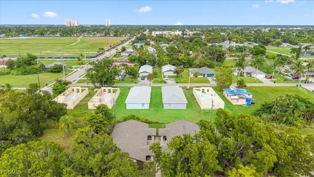 an aerial view of a house with a garden and trees