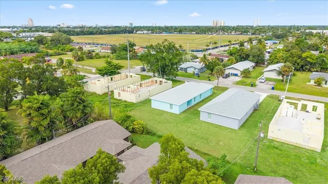 a view of a city with an outdoor space and seating area