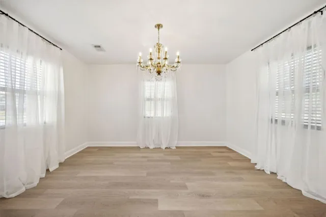 a view of a balcony with wooden floor