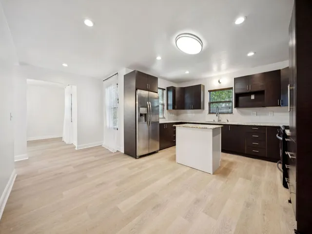a bathroom with a tub and shower