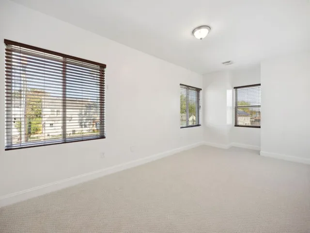 a view of a backyard with a white house