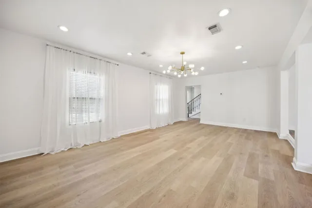 a kitchen with stainless steel appliances granite countertop a stove a refrigerator and a sink