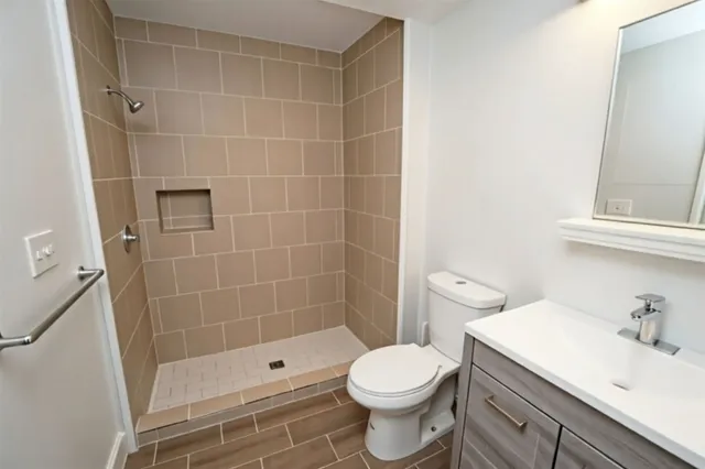 a large bedroom with a bed and a chandelier