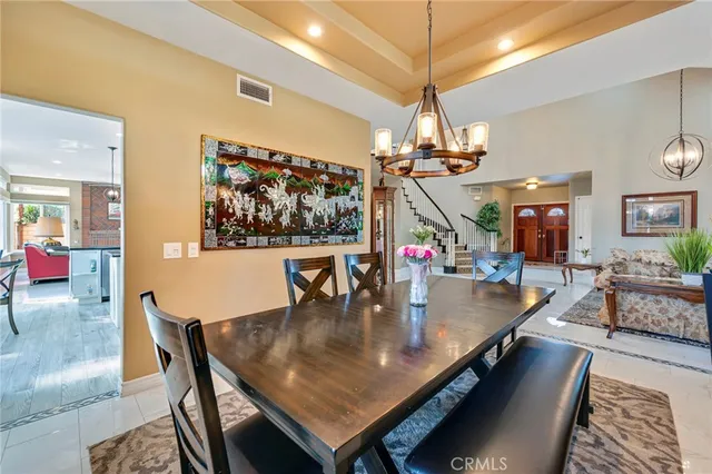 a living room with furniture and a view of kitchen
