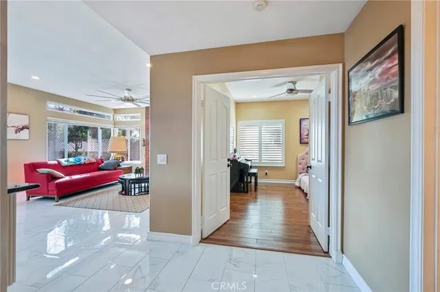 a kitchen with stainless steel appliances wooden floor dining table and chairs