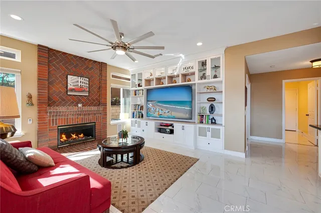 a view of a hallway with wooden floor and stairs