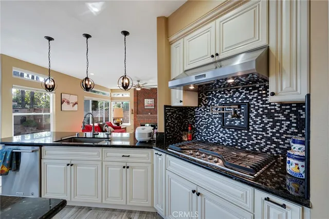 a living room with a bed furniture and a window