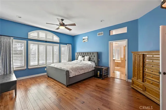 a living room with furniture and ceiling fan