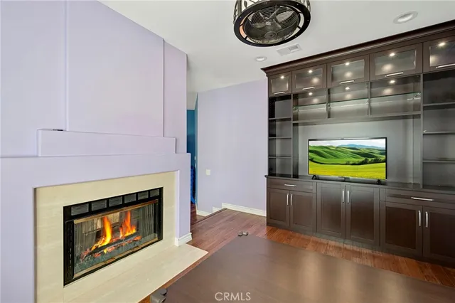 a view of a house with pool and sitting area