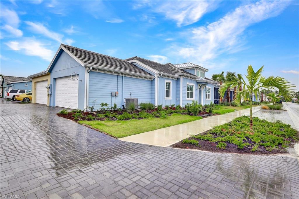 7142 Cayo Coco Lane Naples, FL 34113 - Photo 17 of 17 a house view with a garden space